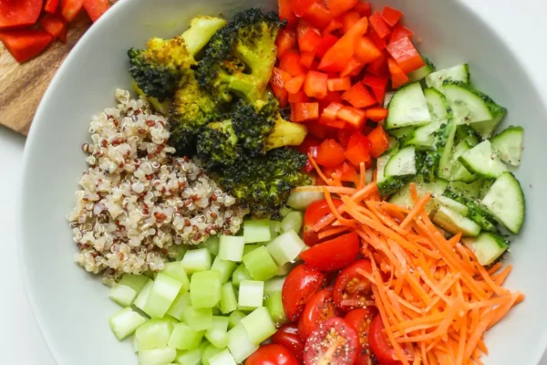 Bowl of quinoa with fresh colourful vegetables