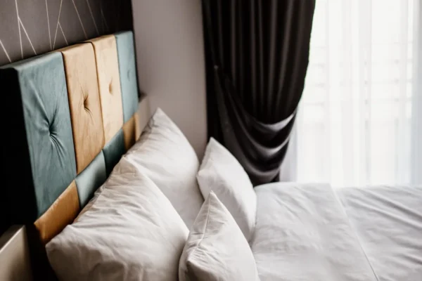 Calm bedroom with soft pillows in daylight